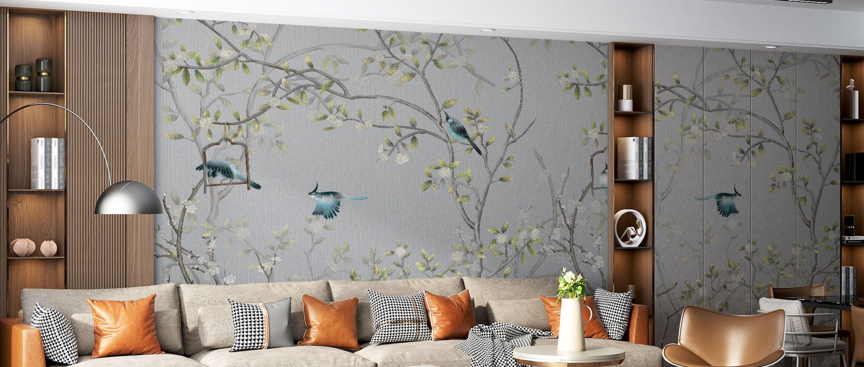 The Chisine Silver Birds Wallpaper reveals a grey botanical landscape with silver birds perched among leaves, offering calm and timeless elegance. Its subtle shimmer elevates interiors, creating refined backdrops for bedrooms or living rooms. The design b