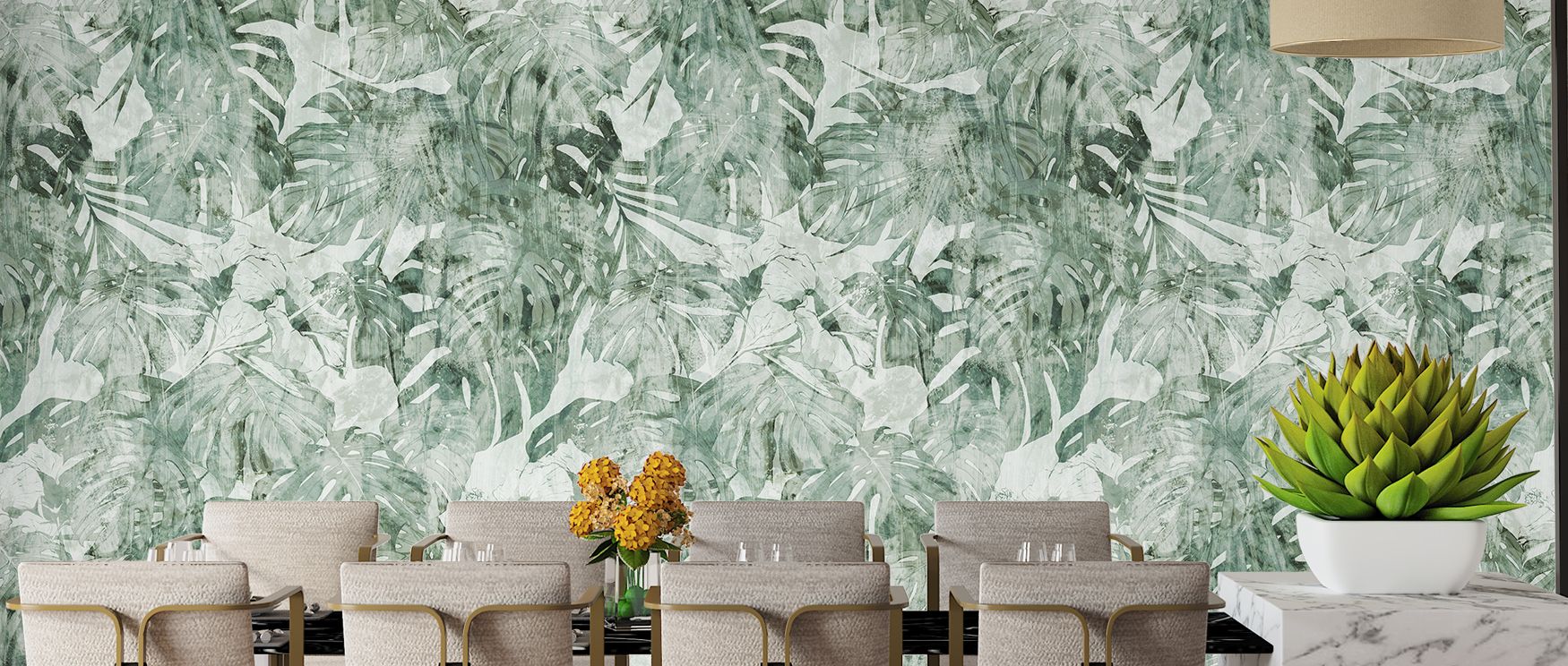 The mural combines bold leaves and subtle tropical accents into a harmonious pattern; it enriches interiors with fresh energy, making living rooms and dining spaces feel alive with botanical charm. 