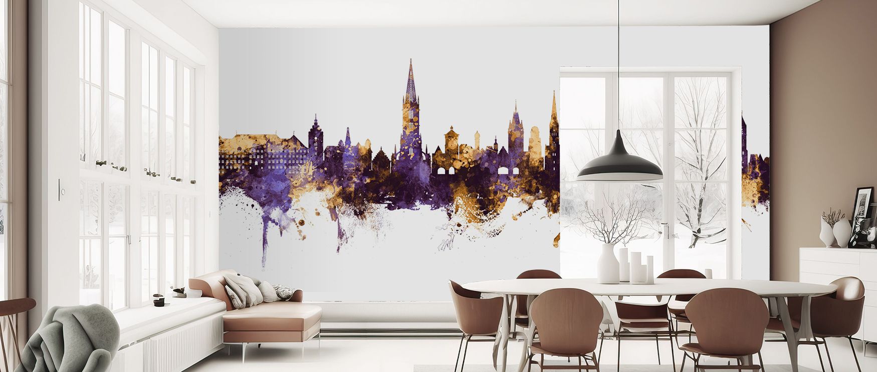 A fusion of artistry and architecture defines Freiburg Germany Skyline Purple & Gold Wallpaper. The skyline glimmers with radiant layering of purple and gold. Rich contrasts highlight dimension, creating expressive atmosphere. The imagery transforms space