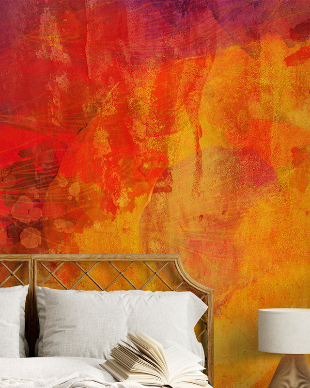 Bold red and orange abstract wallpaper behind a bed, creating a warm and dynamic accent wall in a cozy bedroom 