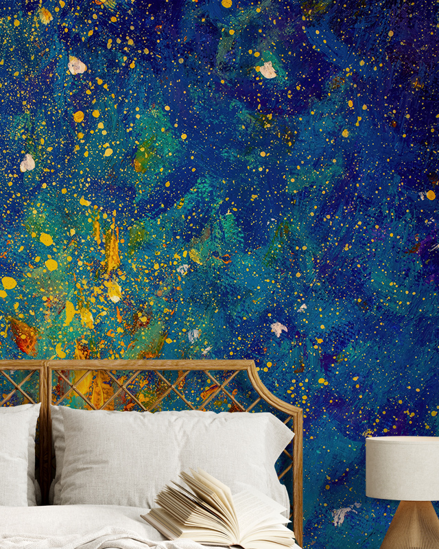 Abstract dark blue wallpaper with splashes of blue and yellow decorates this bedroom, perfect for commercial spaces. 